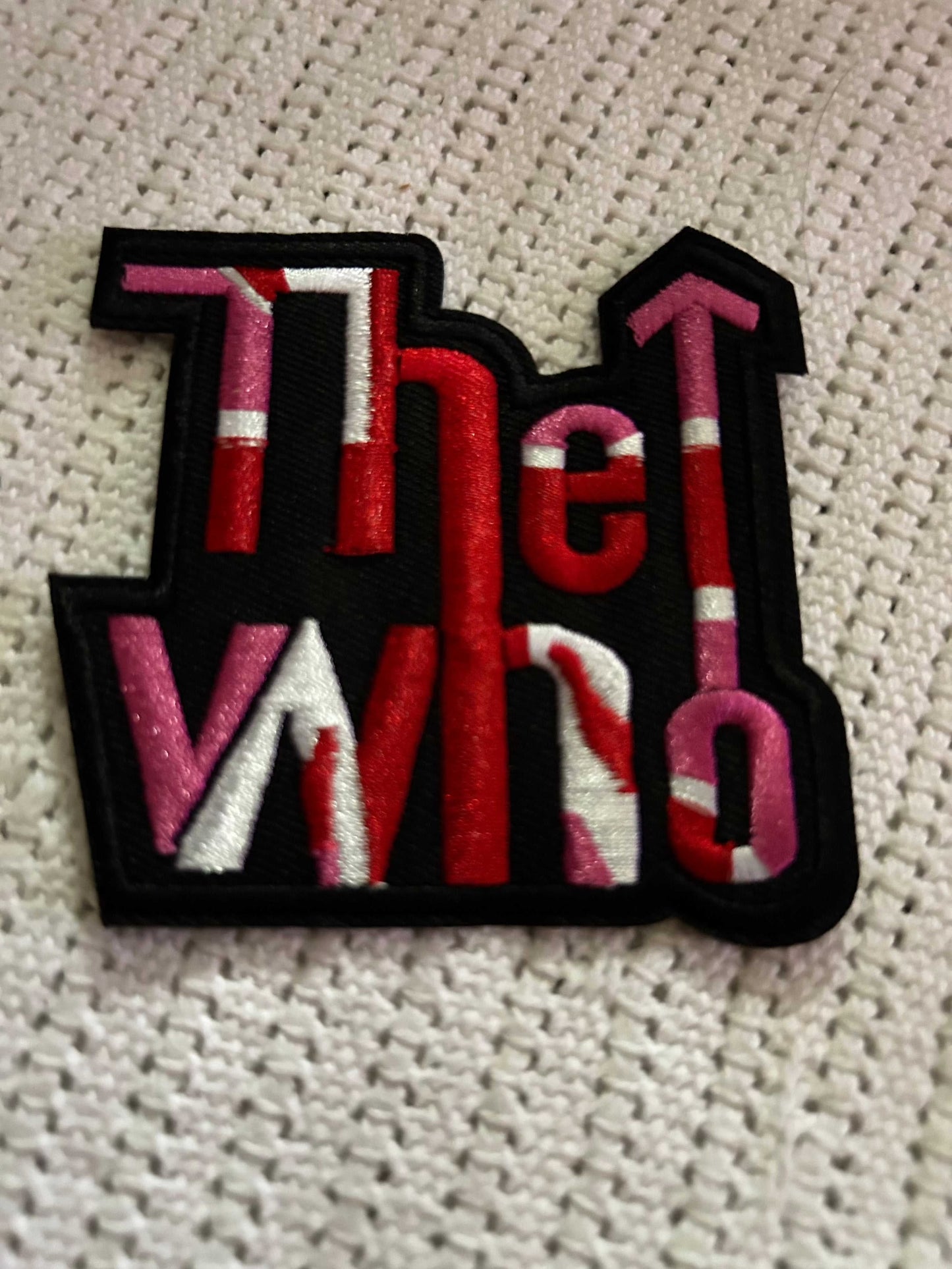 Embroidered logo patch with colorful "The Who" text design on black backing
