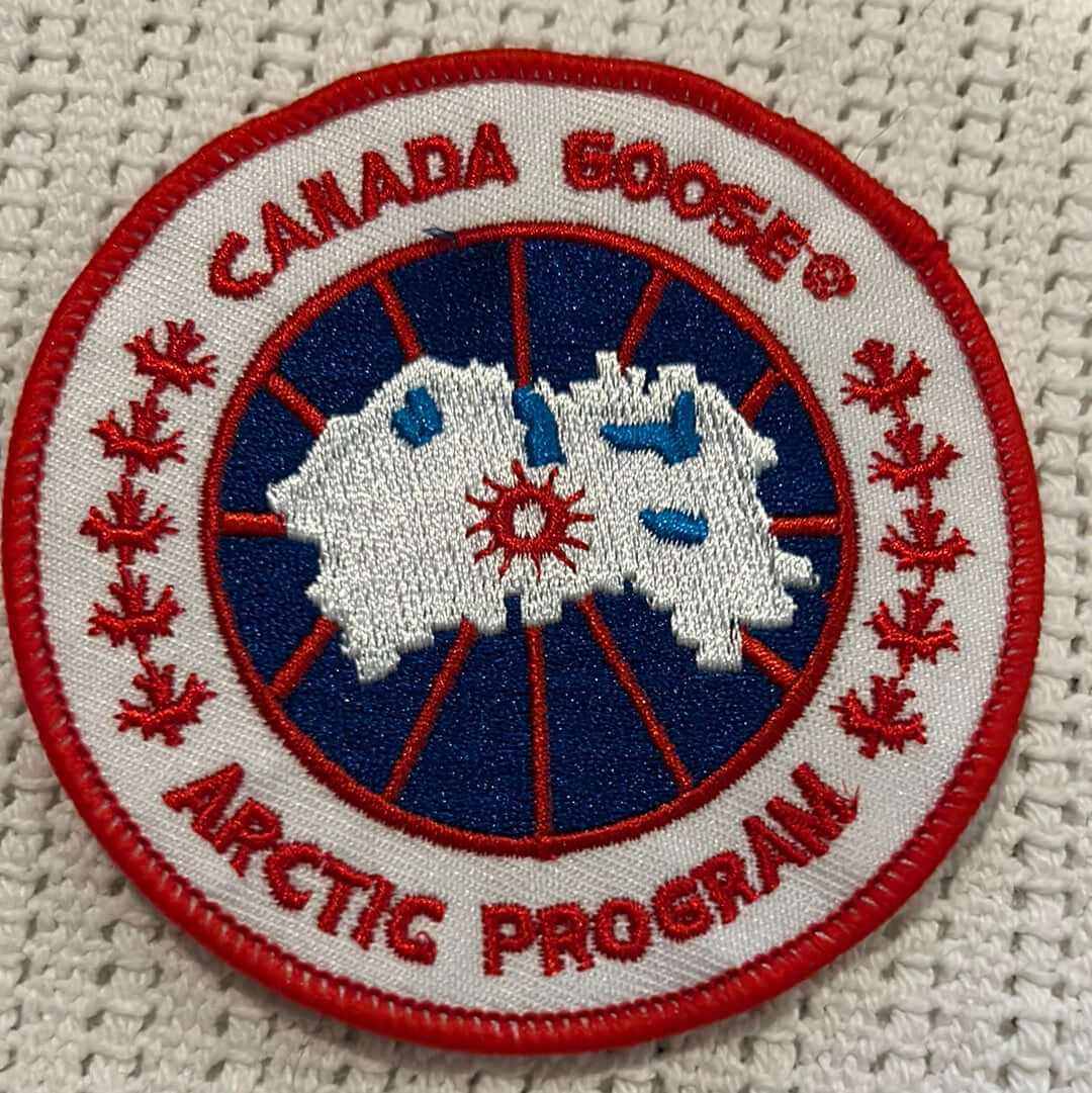 Canada Goose Arctic Program embroidered patch with red maple leaf accents on white background