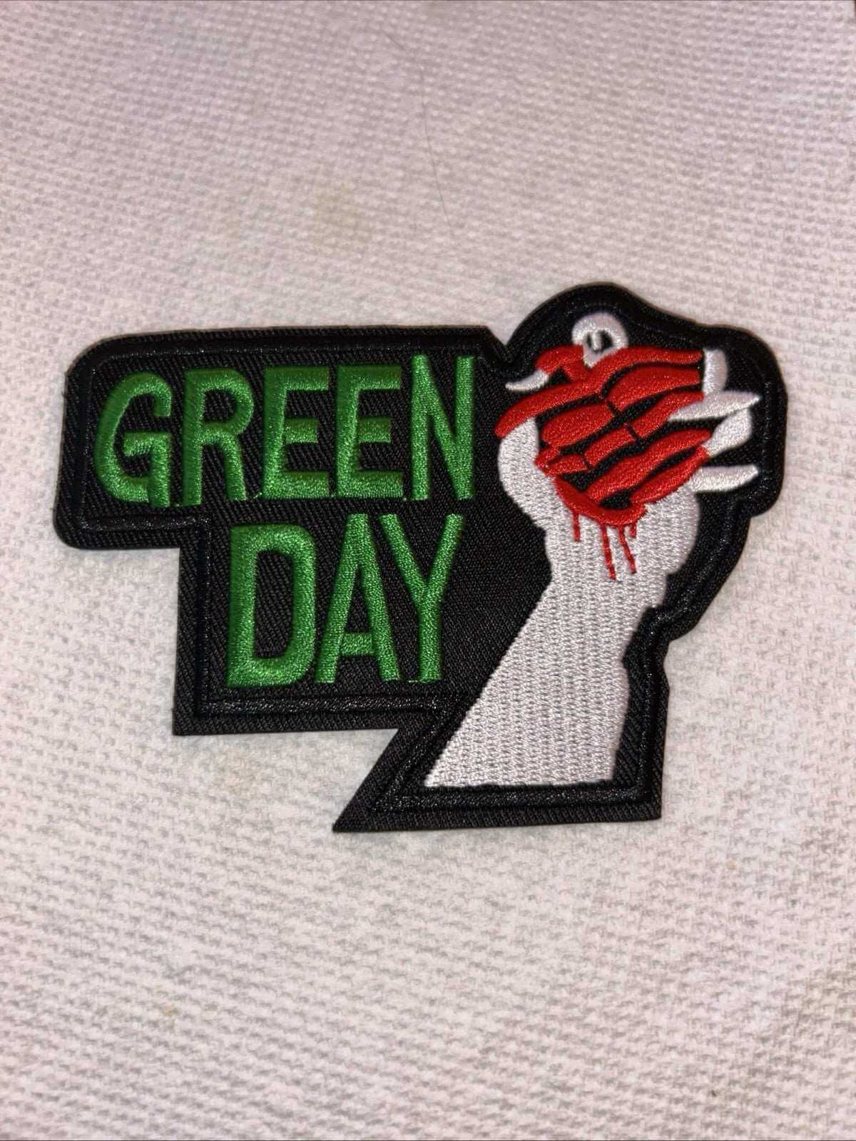 Green Day embroidered iron-on patch featuring a hand with a heart design, perfect for punk rock accessories.
