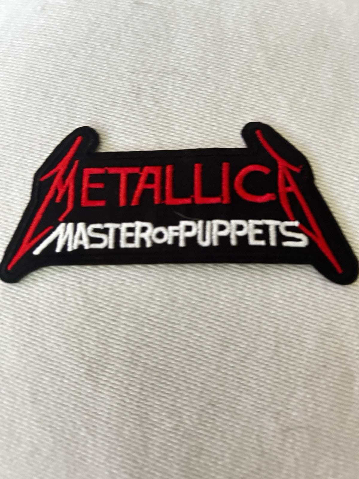 Metallica embroidered sew-on patch featuring Master of Puppets design, perfect for heavy metal fans.