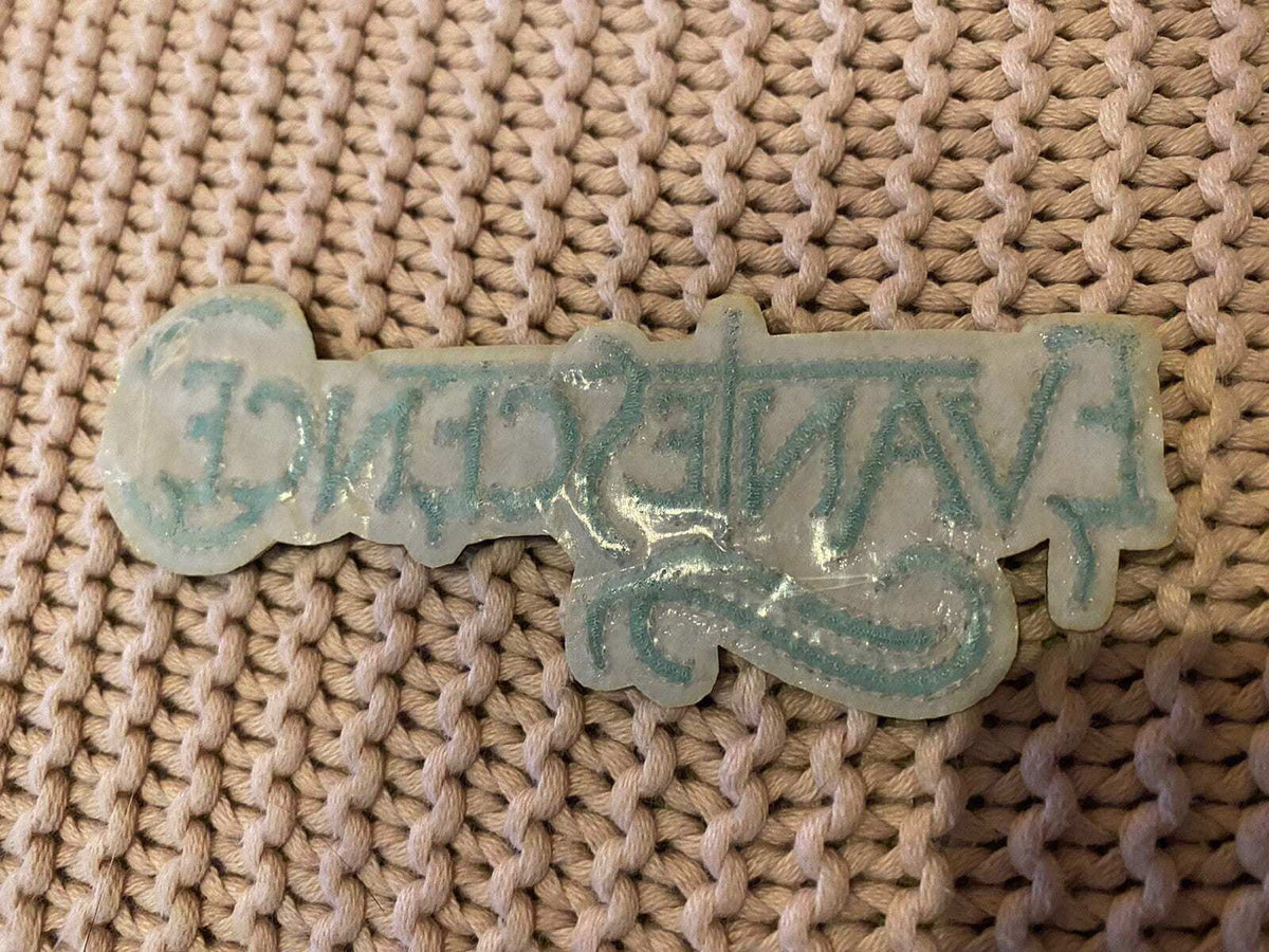 Evanescence embroidered patch 4.5 inch on a woven background, showcasing its intricate design and details.