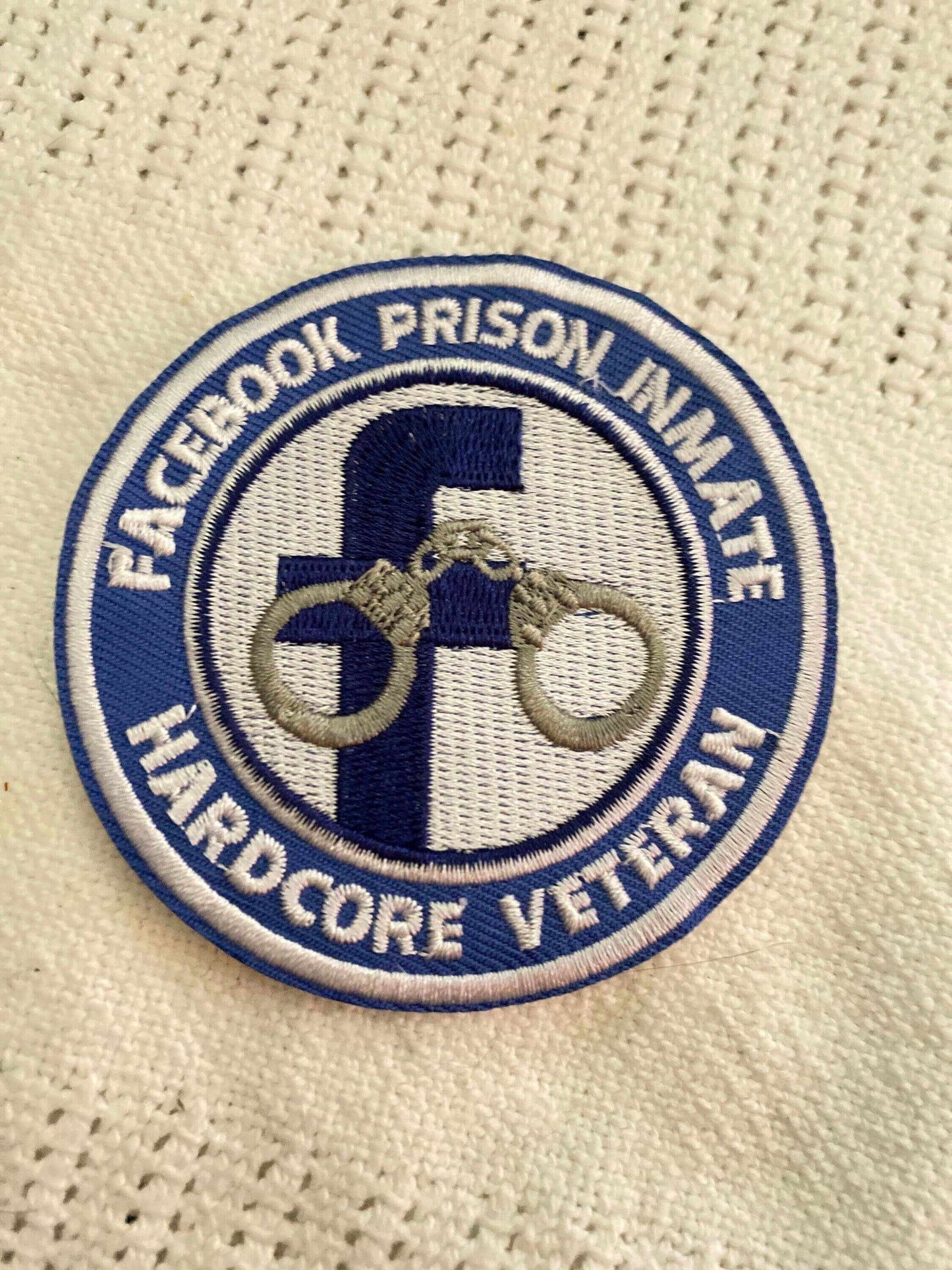 Facebook Prison Inmate Veteran patch with blue Facebook logo and handcuffs, symbolizing strength and resilience