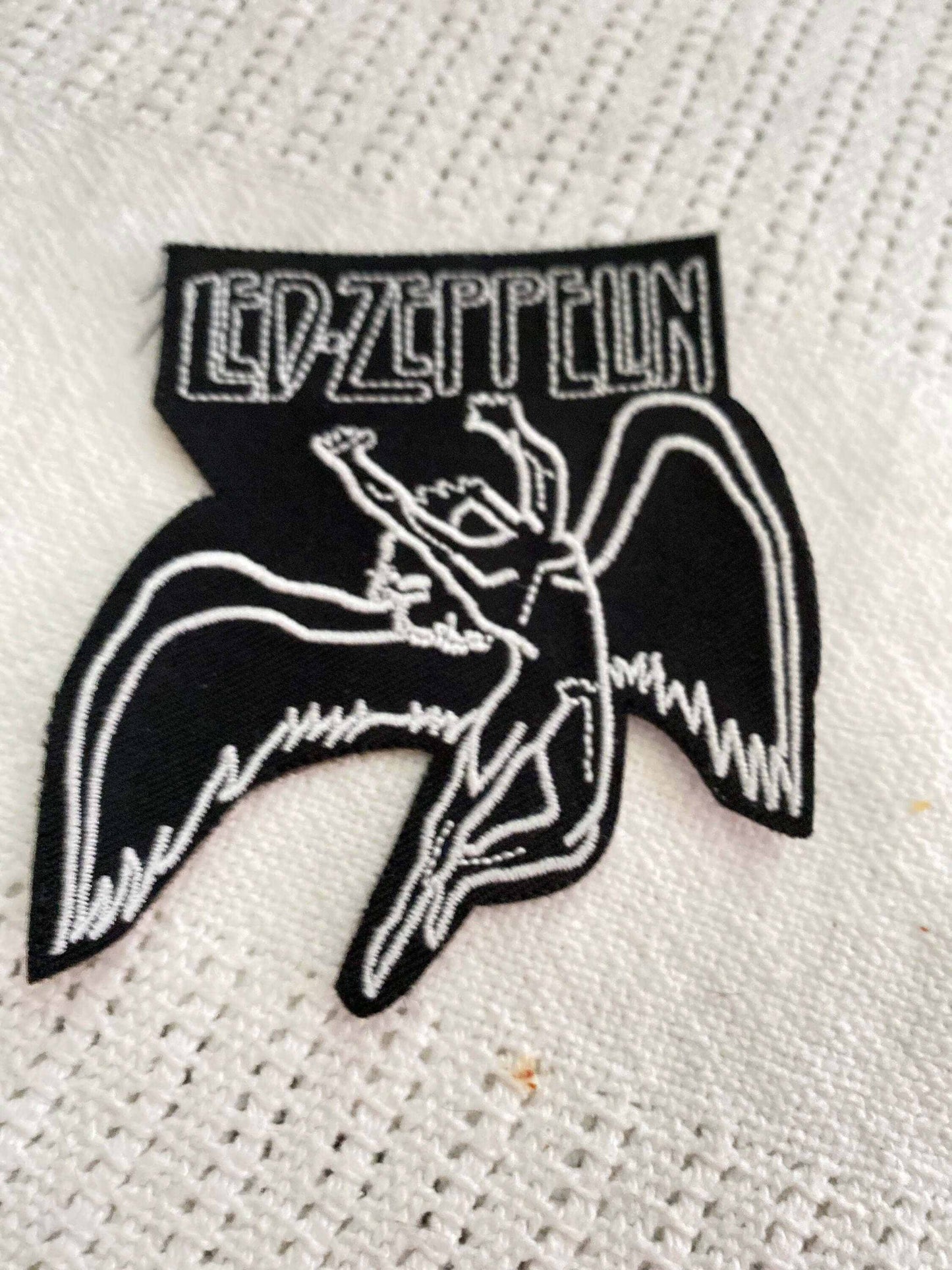 Black and white embroidered Led Zeppelin patch featuring the band's iconic winged figure and stylized logo text