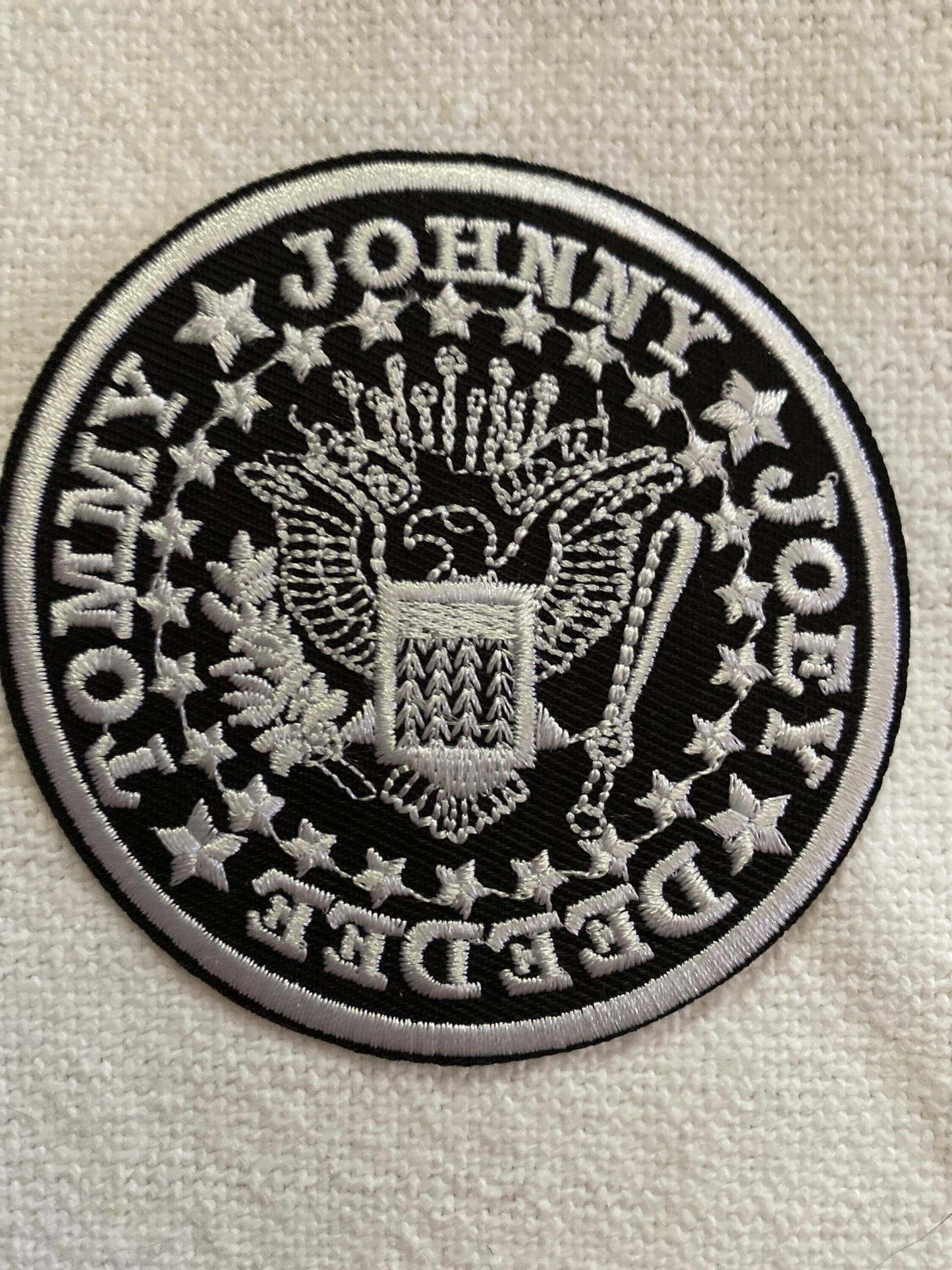 Black and white RAMONES band emblem patch with eagle and band member names embroidery