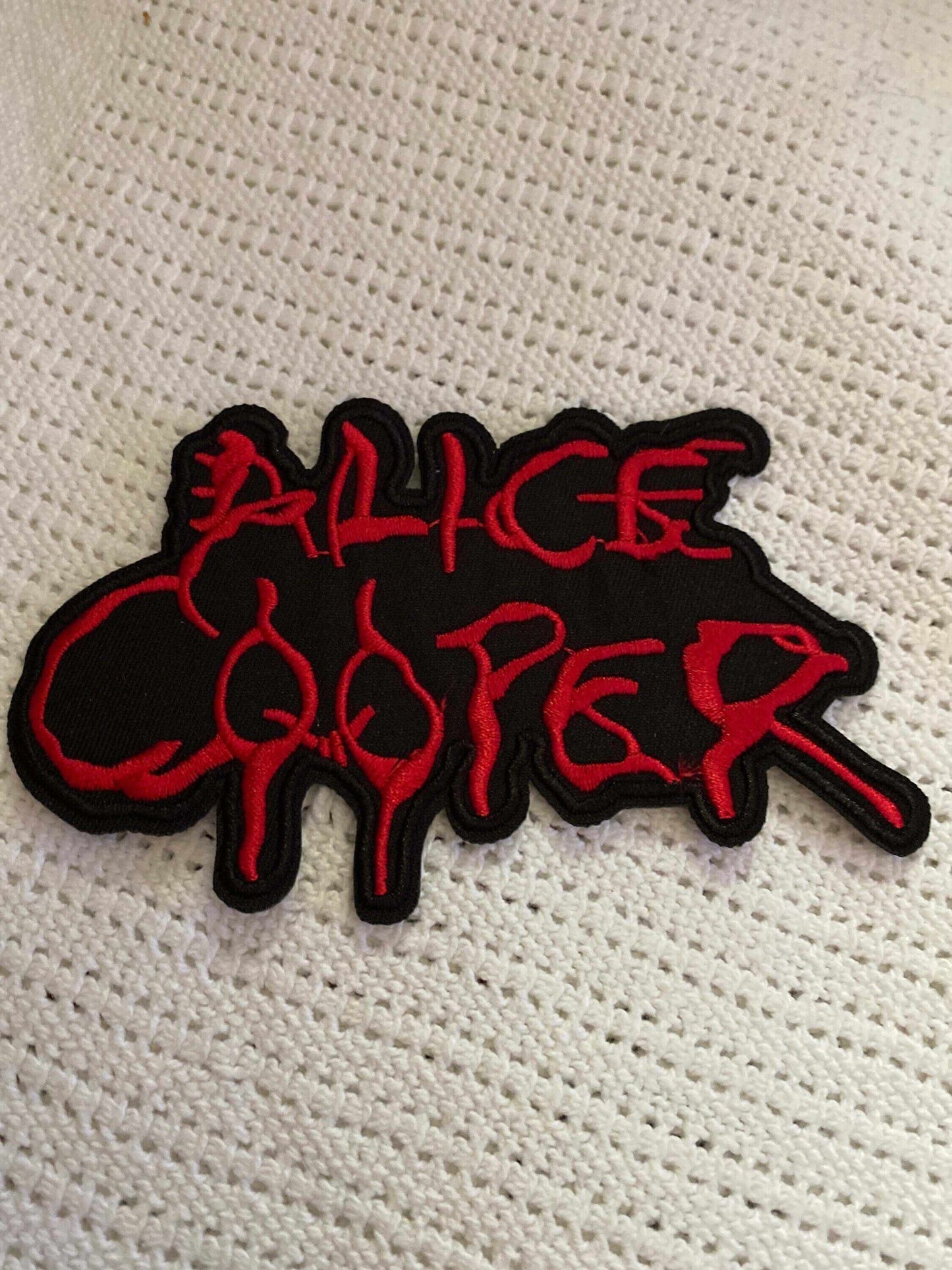 Alice Cooper embroidered patch with red dripping text on black background