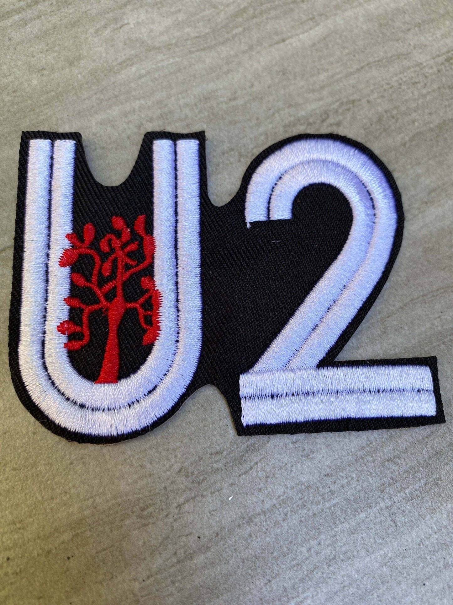 U2 Joshua Tree embroidered patch with white and red design on black background