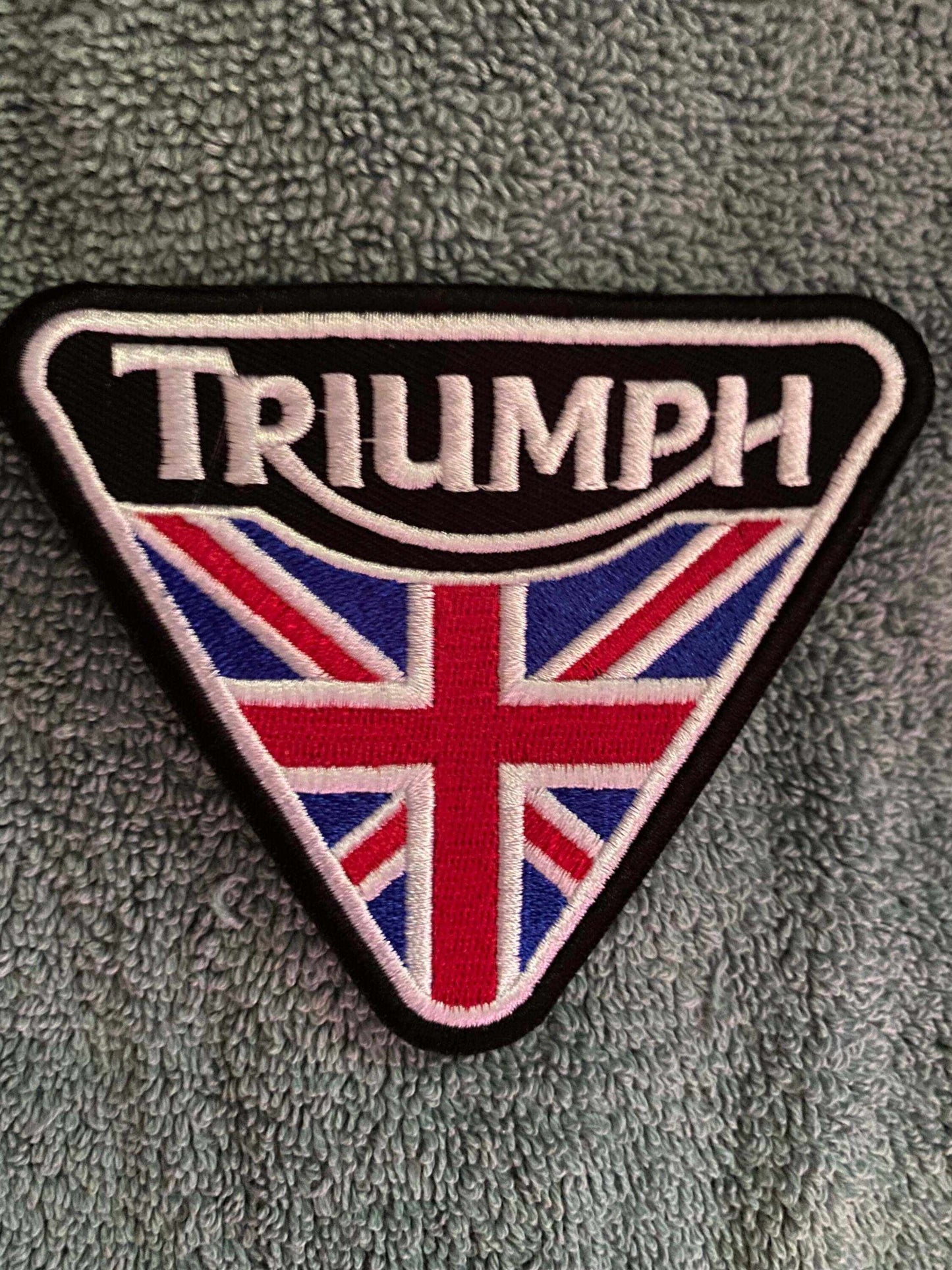 Triumph logo patch with Union Jack representing British motorcycle heritage