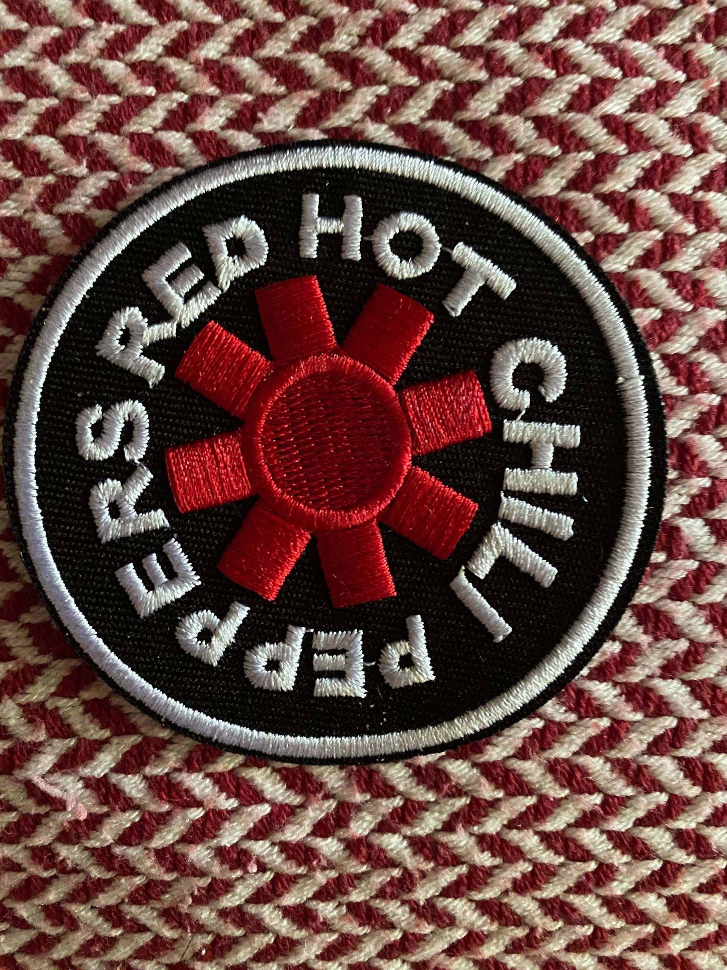 Red Hot Chili Peppers embroidered patch with red asterisk logo on black background