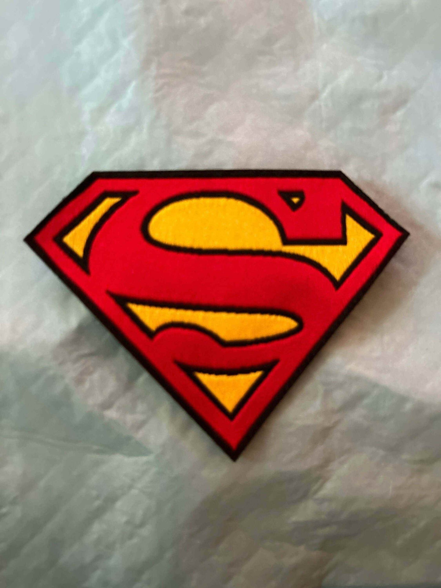 Embroidered Superman 1979 logo patch with bold red and yellow colors and classic emblem design