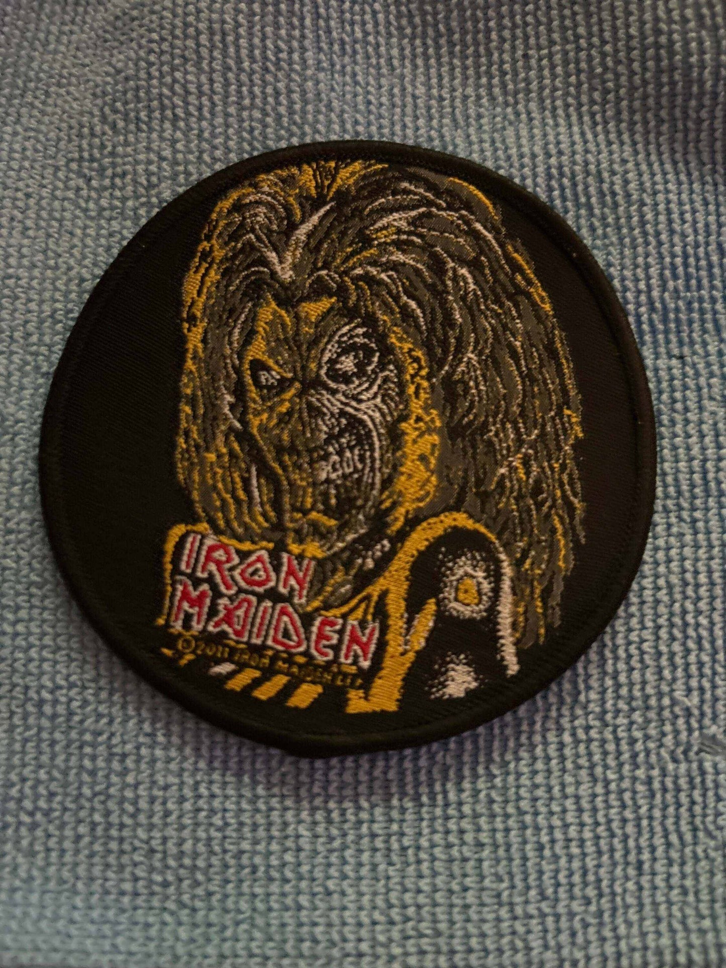 Iron Maiden Killers patch featuring embroidered band mascot Eddie and logo on black fabric background