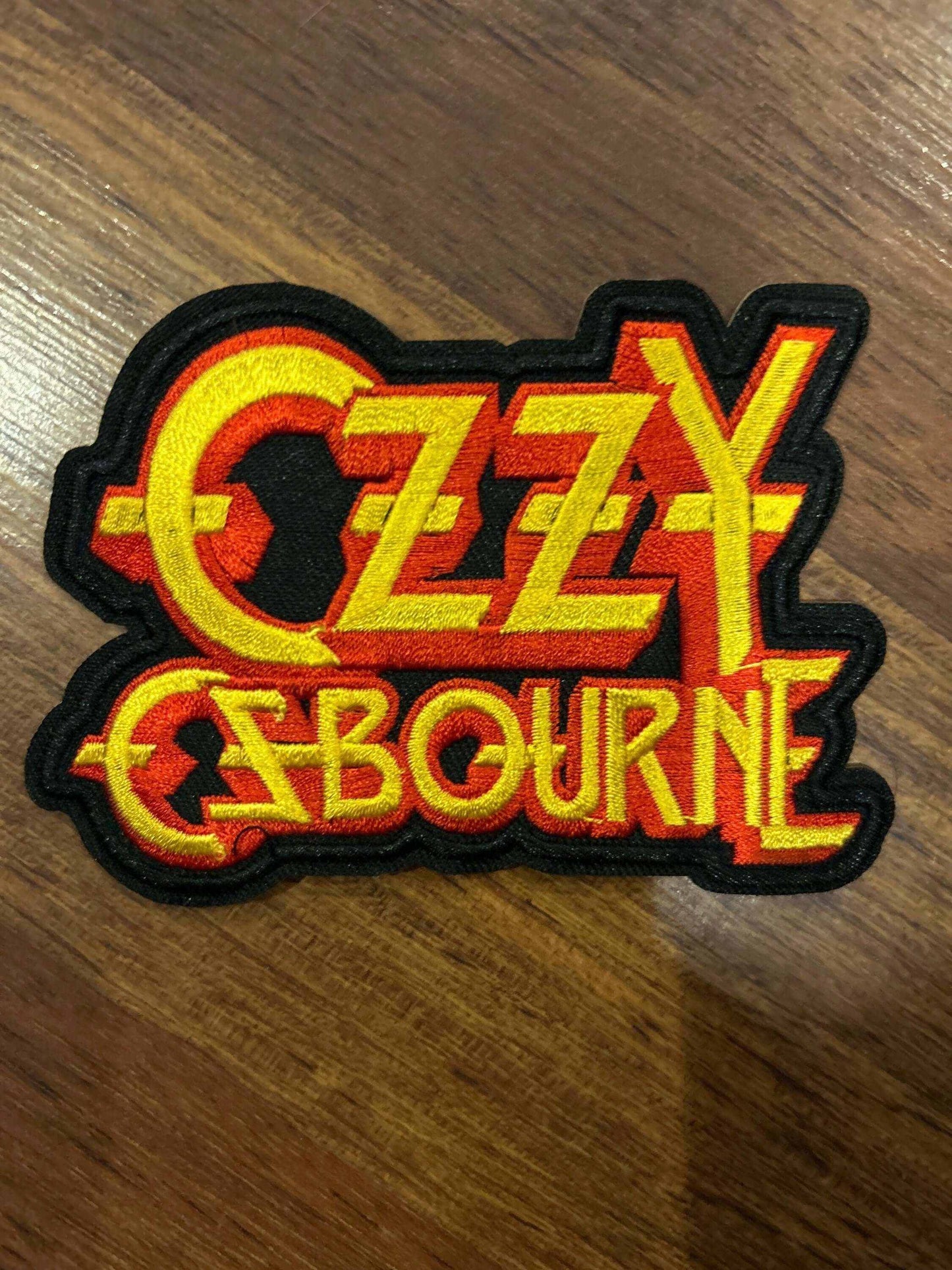Ozzy Osbourne patch with bold yellow and red text on black background for metal fans