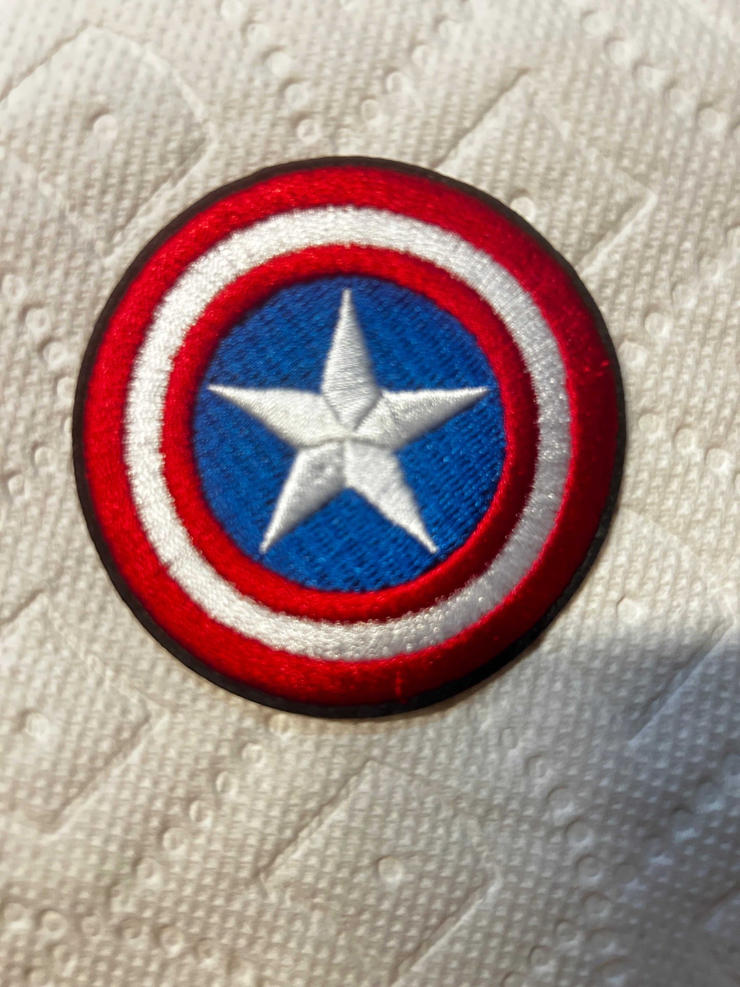 Captain America shield patch iron-on round embroidered logo in red, white, and blue colors 2.75 inches