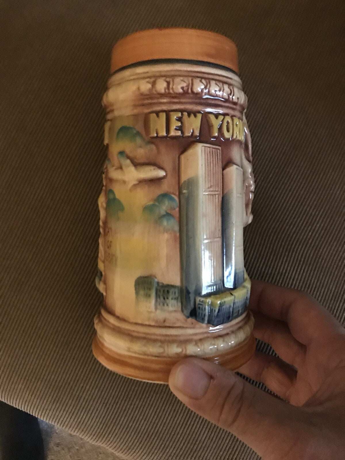 1970’s NYC Souvenir Stein mug with raised design of WTC and plane heading towards North Tower