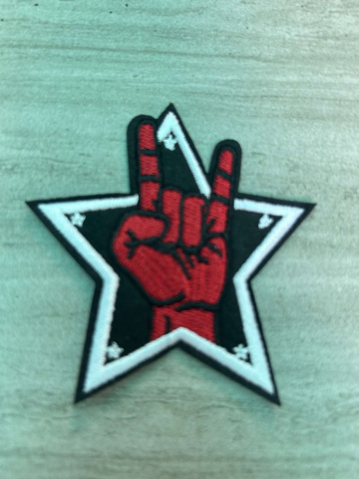 Embroidered heavy metal hand gesture iron-on patch by Star brand, 3x3 inches