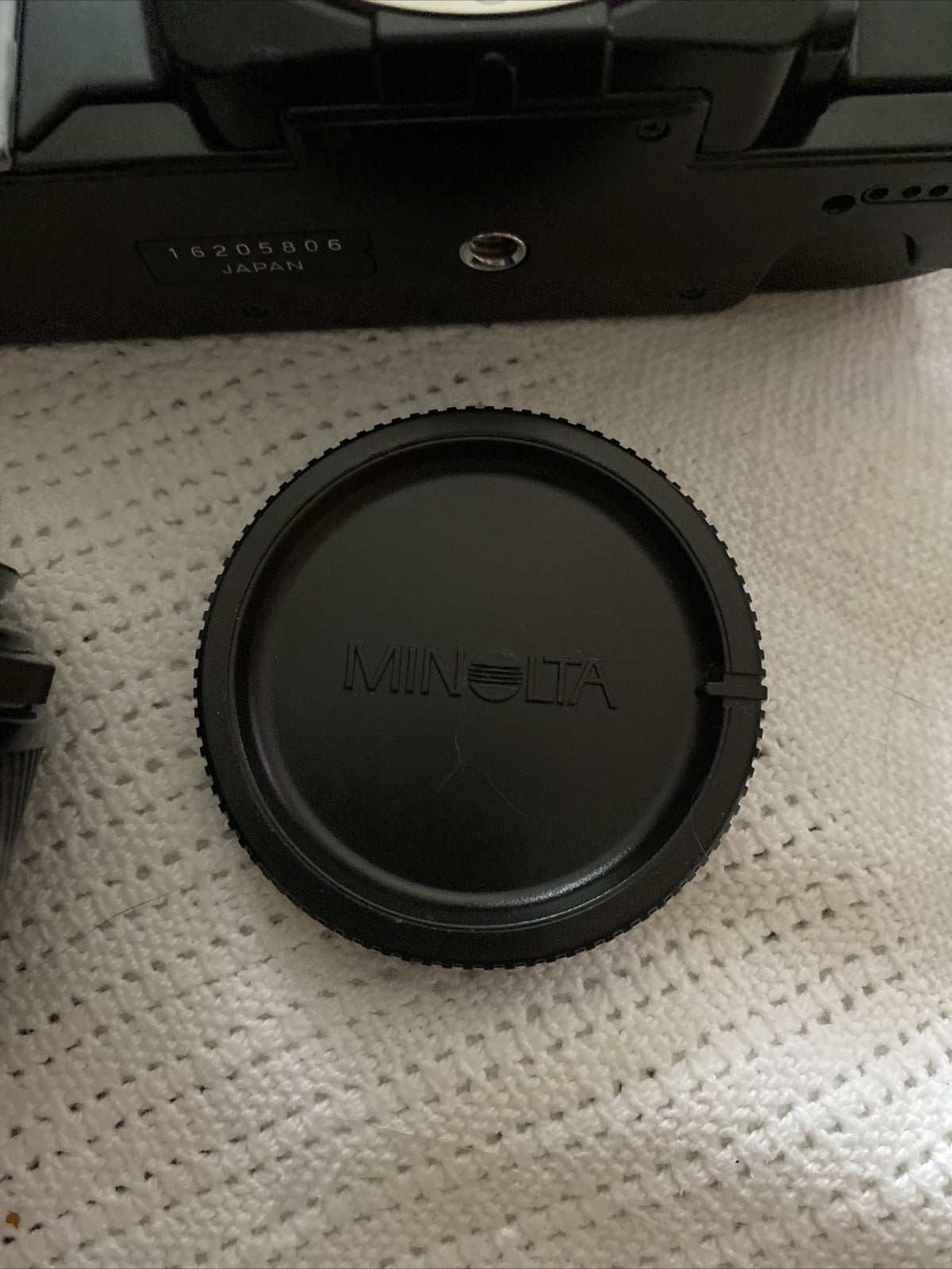 Black Minolta 7000 SLR 35mm camera with 50mm f/1.7 lens and Milisi electronic flash
