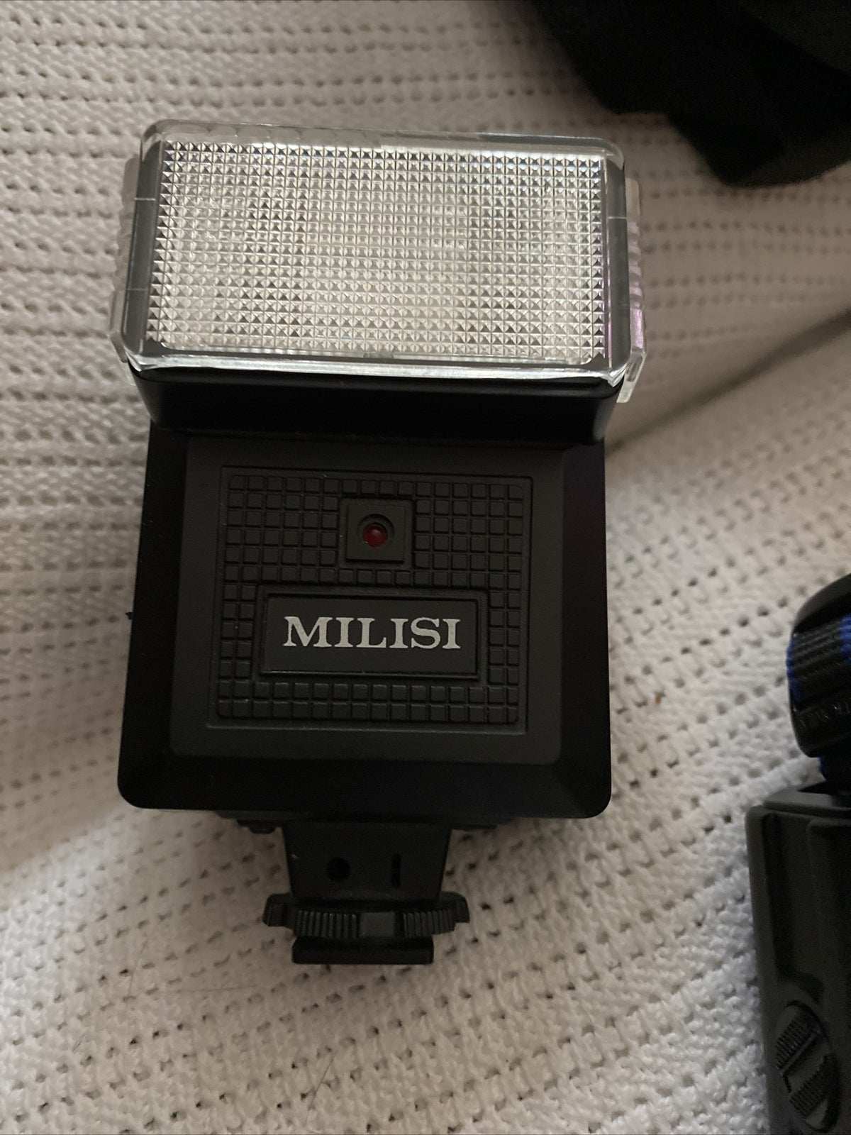 Minolta 7000 SLR 35mm black camera with 50mm f/1.7 lens and Milisi electronic flash