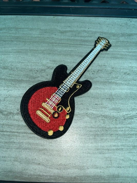 Red electric guitar embroidered iron-on patch for music-themed apparel and accessories, 2.25"x5.5"