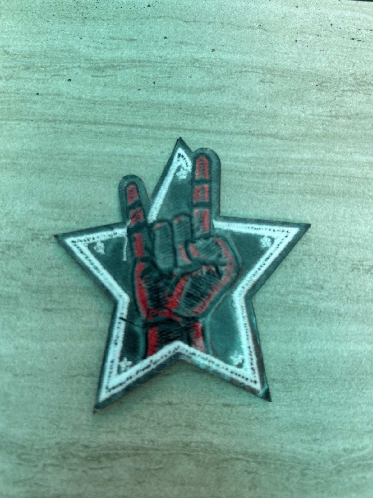 Heavy metal hand gesture embroidered iron-on patch by Star brand