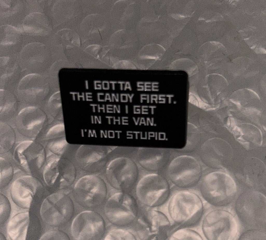 I Gotta See The Candy First enamel pin with bold humorous text, 1.5 by 0.75 inches, quirky accessory