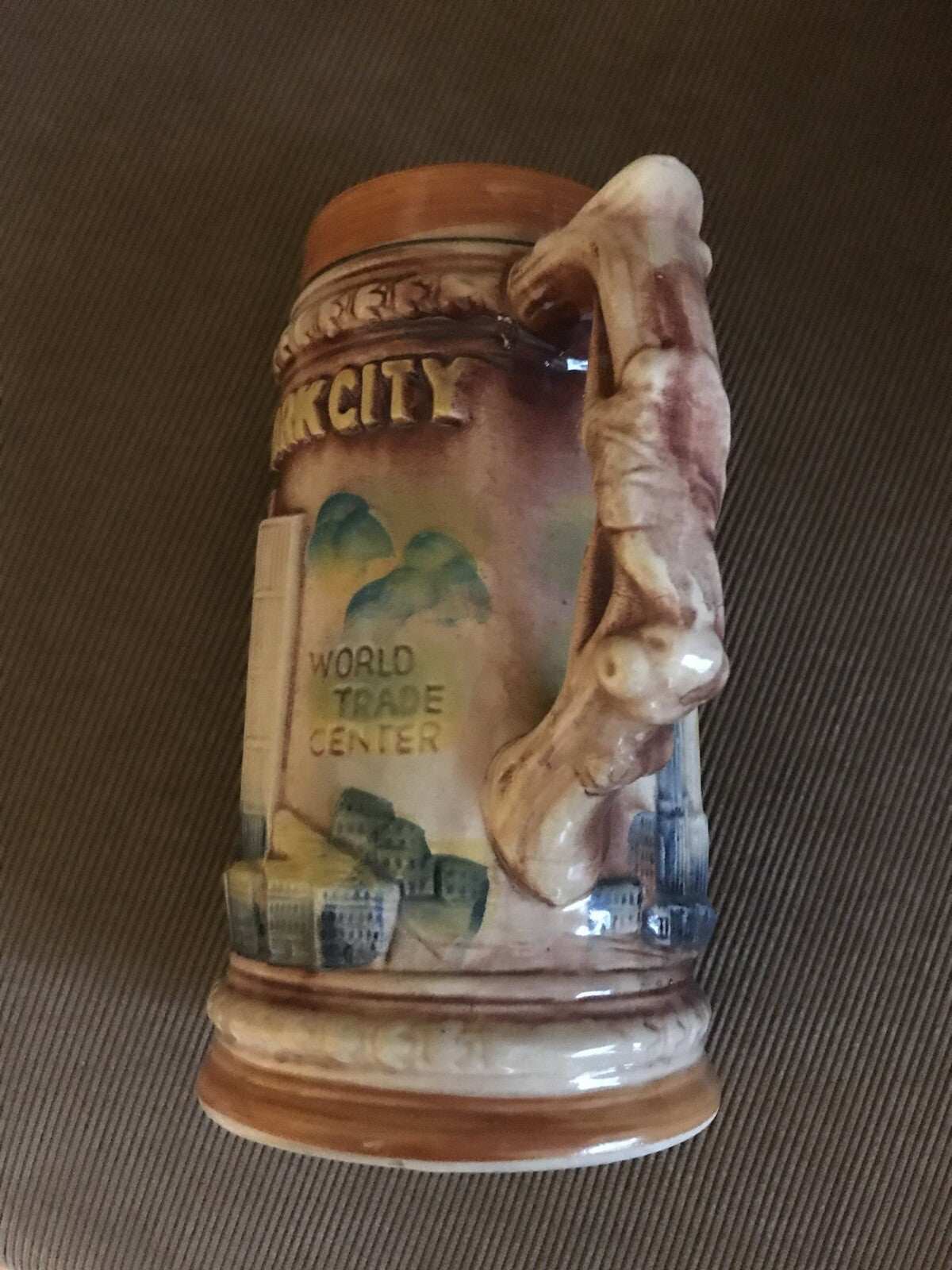 1970’s NYC Souvenir Stein mug with raised multicolor design of WTC, plane, and NYC landmarks, made in Japan, early 70s