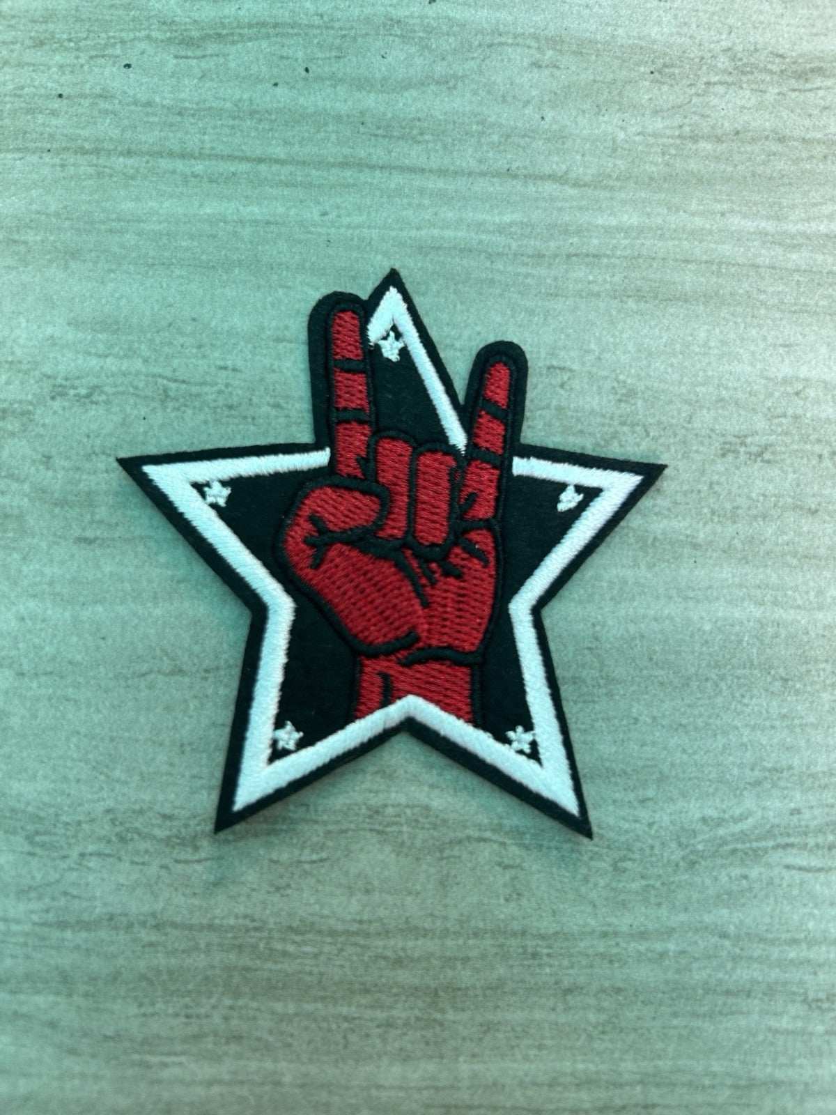 Embroidered heavy metal hand gesture iron-on patch by Star brand